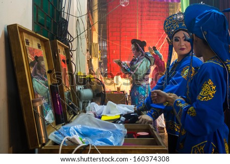 AMPANG - OCTOBER 9: Unidentified Chinese Opera actresses make up before their act at the Kau Ong Yah Temple in Ampang, Malaysia on October 9, 2013; celebrating the nine emperor gods festival.