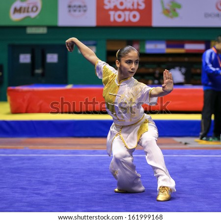 KUALA LUMPUR - NOV 03: Ilayda Emen of Turkey shows her fighting style in the \'changquan compulsory\' event at the 12th World Wushu Championship on November 03, 2013 in Kuala Lumpur, Malaysia.
