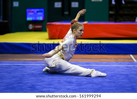 KUALA LUMPUR - NOV 03: Juliette Vauchez of France shows her fighting style in the \'changquan compulsory\' event at the 12th World Wushu Championship on November 03, 2013 in Kuala Lumpur, Malaysia.