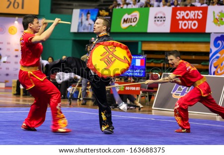 KUALA LUMPUR - NOV 05: France's dalian team performs a fight scene in the Men's Dual Event at the 12th World Wushu Championship on November 05, 2013 in Kuala Lumpur, Malaysia.