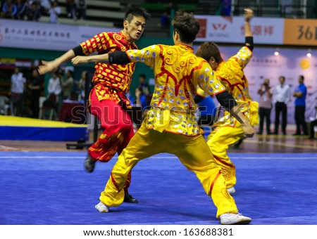 KUALA LUMPUR - NOV 05: South Korea\'s dalian team performs a fight scene in the Men\'s Dual Event at the 12th World Wushu Championship on November 05, 2013 in Kuala Lumpur, Malaysia.