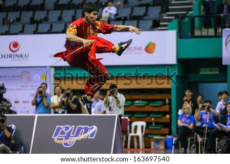 KUALA LUMPUR - NOV 03: Malaysia\'s Ng Say Yoke executes a high kick in the Men\'s \'Daoshu\' Event at the 12th World Wushu Championship on November 03, 2013 in Kuala Lumpur, Malaysia.