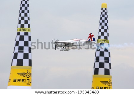 PUTRAJAYA, MALAYSIA - MAY 17, 2014: Paul Bonhomme of Great Britain, in an Edge 540 V2 plane flies past the pylons duirng the qualifying session of the Red Bull Air Race World Championship 2014.
