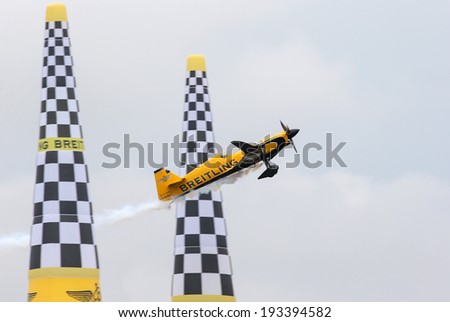 PUTRAJAYA, MALAYSIA - MAY 17, 2014: Nigel Lamb from Great Britain flies his MXS-R plane through the race course at the qualifying session of the Red Bull Air Race World Championship 2014 in Putrajaya.