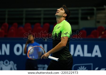 SEPTEMBER 23, 2014 - KUALA LUMPUR, MALAYSIA: Marinko Matosevic of Australia watches the call review on the screen in his match at the Malaysian Open Tennis 2014. This is an ATP sanctioned tournament.