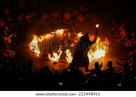 BALI, INDONESIA - SEPTEMBER 19, 2014: Hanuman is set to be burnt alive during a performance of the traditional Balinese Kecak Fire Dance at the Uluwatu Temple in Bali.