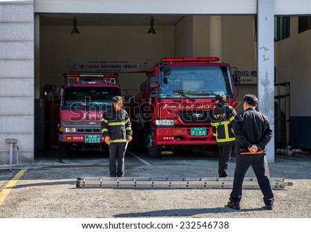 JEONJU, SOUTH KOREA - 3 NOVEMBER 2014: Firefighters prepare to start morning drills and practices in a fire department station in the Jeonju traditional Korean Hanok village.