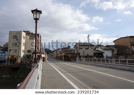 TAKAYAMA, JAPAN - DECEMBER 3, 2014: Low rise buildings and clean river and streets is a common cityscape find in Japan. Strong environmental laws keeps the nation clean and green.