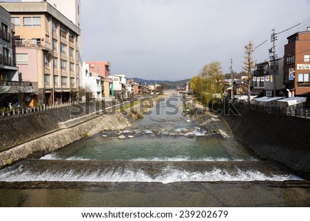 TAKAYAMA, JAPAN - DECEMBER 3, 2014: Low rise buildings, clean river and streets is a common cityscape find in Japan. Strong environmental laws keeps the nation clean and green.
