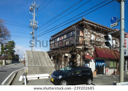 MATSUMOTO, JAPAN - DECEMBER 3, 2014: Low rise buildings, clean streets and very few cars are a common cityscape find in Japan. Strong environmental laws keeps the nation clean and green.