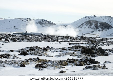 ICELAND - MARCH 24, 2015: Iceland electricity generation plants releases steam as a by-product. It uses geothermal energy from the earth and this an environmental friendly source of energy supply.
