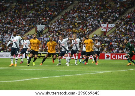 May 27, 2015 - Shah Alam, Malaysia: Malaysian strikers (orange jersey) attacks the Tottenham Hotspur (white jersey) goal in a friendly match. Tottenham Hotspur is on a Asia-Australia tour.