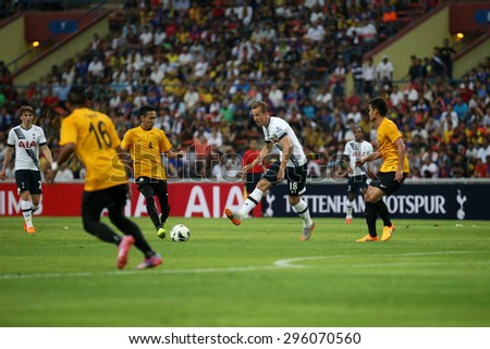 May 27, 2015- Shah Alam, Malaysia: Tottenham Hotspur\'s striker Harry Kane (18) kicks the ball in the friendly match against Malaysia (orange jersey). Tottenham Hotspur is on a Asia-Australia tour.