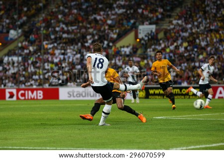 May 27, 2015- Shah Alam, Malaysia: Tottenham Hotspur\'s striker Harry Kane (18) kicks the ball in the friendly match against the Malaysian Selection Team. Tottenham Hotspur is on a Asia-Australia tour.