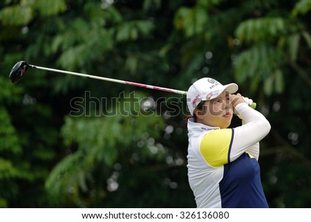KUALA LUMPUR, MALAYSIA - OCTOBER 10, 2015: China\'s Shanshan Feng tees off at the sixth hole of the KL Golf & Country Club on Round 3 day at the 2015 Sime Darby LPGA Malaysia golf tournament.