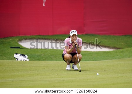 KUALA LUMPUR, MALAYSIA - OCTOBER 10, 2015: South Korea\'s So Yeon Ryu checks the green of the 18th hole of the KL Golf & Country Club during the 2015 Sime Darby LPGA Malaysia golf tournament.