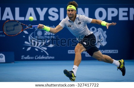KUALA LUMPUR, MALAYSIA - OCTOBER 03, 2015: Spain\'s tennis player David Ferrer plays a forehand return at the 2015 Malaysian Open tennis tournament from Sep 26 - Oct 4, 2015 in Stadium Putra.