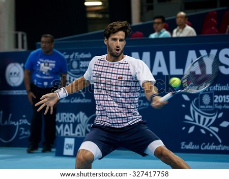 KUALA LUMPUR, MALAYSIA - OCTOBER 03, 2015: Spain\'s tennis player Feliciano Lopez plays a forehand return at the 2015 Malaysian Open tennis tournament from Sep 26 - Oct 4, 2015 in Stadium Putra.