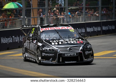 KUALA LUMPUR, MALAYSIA - AUGUST 08, 2015: Todd Kelly from the Nissan Motorsports team races in the V8 Supercars Street Challenge at the 2015 Kuala Lumpur City Grand Prix.