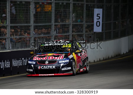 KUALA LUMPUR, MALAYSIA - AUGUST 08, 2015: Craig Lowndes from the Red Bull Racing Australia team races in the V8 Supercars Street Challenge at the 2015 Kuala Lumpur City Grand Prix.
