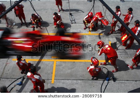 SEPANG, MALAYSIA - APRIL 4: Scuderia Ferrari Marlboro crews does pit-stop practice at the 2009 F1 Petronas Malaysian Grand Prix April 4, 2009 in Sepang Malaysia.