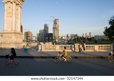TIANJIN, CHINA - JUNE 3: Cyclists go home after work in one of China\'s largest city June 3, 2009 in Tianjin, China.