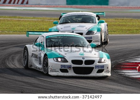 SEPANG, MALAYSIA - AUGUST 8: Petronas Team BMW cars in action at the 12 hour race of the 2009 Merdeka Millennium Endurance Race August 8, 2009 in Sepang, Malaysia.