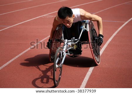 KUALA LUMPUR - AUGUST 16: Singapore\'s wheel-chair athlete competes at the track and field event of the fifth ASEAN Para Games on August 16, 2009 in Kuala Lumpur, Malaysia.