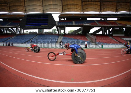 KUALA LUMPUR - AUGUST 16: ASEAN nations\' wheel chair athletes compete at the track and field event of the fifth ASEAN Para Games on August 16, 2009 in Kuala Lumpur, Malaysia.