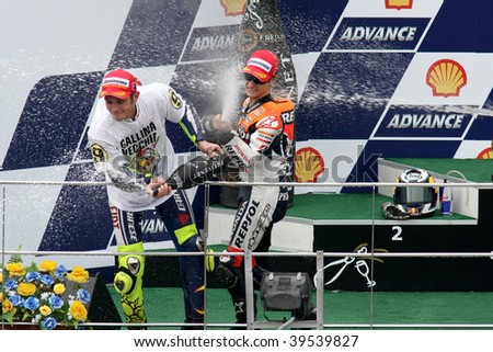 SEPANG, MALAYSIA - OCTOBER 25: Winners of the MotoGP race celebrating on the podium at the 2009 Shell Advance Malaysian Motorcycle GP. October 25, 2009 in Malaysia.