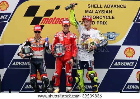 SEPANG, MALAYSIA - OCTOBER 25: Winners of the MotoGP race on the podium at the 2009 Shell Advance Malaysian Motorcycle GP. October 25, 2009 in Malaysia.