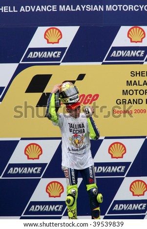 SEPANG, MALAYSIA - OCTOBER 25: Newly crowned MotoGP world champion Valentino Rossi celebrating on the podium at the 2009 Shell Advance Malaysian Motorcycle GP. October 25, 2009 in Malaysia.