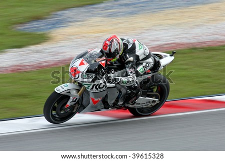 SEPANG, MALAYSIA - OCTOBER 25: Scot Racing Team\'s Gabor Talmasci in action in the 2009 Shell Advance Malaysian Motorcycle GP. October 25, 2009 in Malaysia.