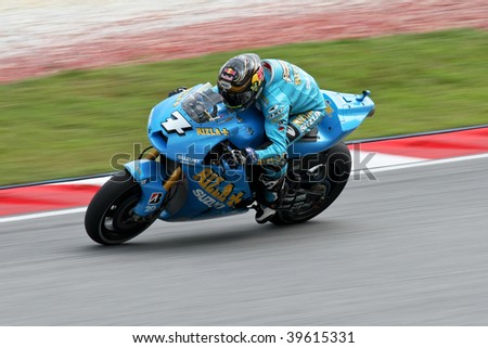 SEPANG, MALAYSIA - OCTOBER 25: Team Suzuki\'s Chris Vermeulen in action in the 2009 Shell Advance Malaysian Motorcycle GP. October 25, 2009 in Malaysia.