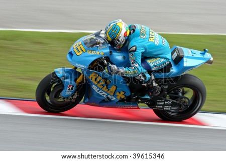SEPANG, MALAYSIA - OCTOBER 25: Team Suzuki\'s Loris Capirossi in action in the 2009 Shell Advance Malaysian Motorcycle GP. October 25, 2009 in Malaysia.