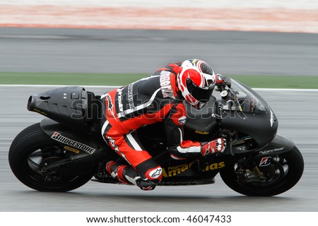 SEPANG - FEBRUARY 05: Hector Barbera of the Aspar Ducati team practices in the pre-season testing in preparation for the MotoGP championship. February 05, 2010 in Sepang, Malaysia.