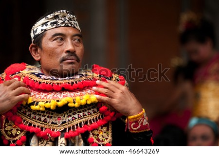 BALI - JANUARY 15: Actor dressing up to prepare for his role in play called \'Topeng Tua\' to welcome guests to his village. January 15, 2010 in Bali, Indonesia.