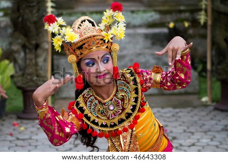 BALI - JANUARY 15: Young Balinese girl performs a welcome dance in a \'full moon ceremony\' in the Bedulu village in Ubud, Bali. January 15, 2010 in Bali, Indonesia.