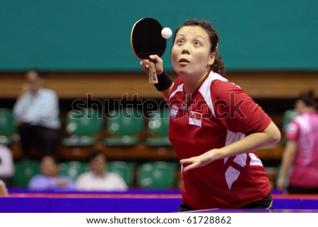 KUALA LUMPUR, MALAYSIA - SEPTEMBER 24: Wang Yuegu, Singapore (ITTF World Rank 21) tosses ball to serve at the Volkswagen 2010 Women's World Cup in table tennis on September 24, 2010 in Kuala Lumpur.