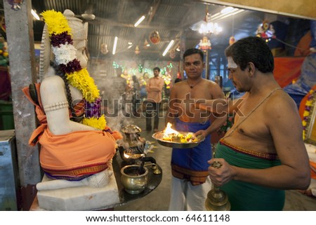 KUALA LUMPUR, MALAYSIA - NOVEMBER 5: Temple priests offer prayers on Diwali festival day on November 5, 2010 at the Hanuman Temple in Kuala Lumpur.  Diwali celebrates the triumph of good over evil.