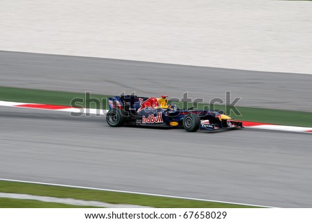 KUALA LUMPUR - APRIL 4: Sebastian Vettel of Red Bull Racing team powers down the track on race day at the 2010 Petronas Malaysia Grand-Prix on April 4, 2010 in Sepang International Circuit, Malaysia.