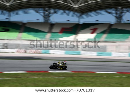 SEPANG, MALAYSIA - FEBRUARY 2: MotoGP rider Colin Edwards of the Monster Yamaha Tech 3 Team practices at the MotoGP winter tests at the Sepang International Circuit on February 2, 2011 in Malaysia.