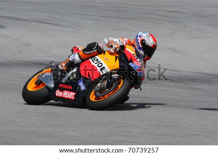 SEPANG, MALAYSIA - FEBRUARY 2: MotoGP rider Casey Stoner of the Repsol Honda Team practices at the 2011 MotoGP winter tests at the Sepang International Circuit. February 2, 2011 in Malaysia.