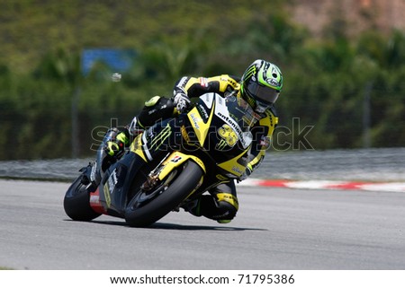 SEPANG, MALAYSIA - FEBRUARY 22: MotoGP rider Cal Crutchlow of Monster Yamaha Tech 3 team practices at the 2011 MotoGP winter tests at the Sepang International Circuit. February 22, 2011 in Malaysia.