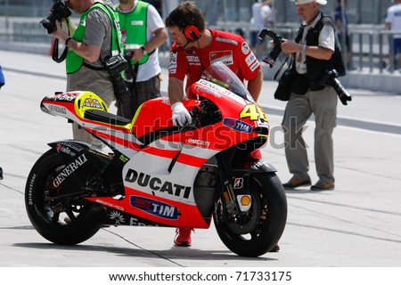 - FEBRUARY 22: Ducati Malboro Team mechanic prepares Valentino Rossi ...