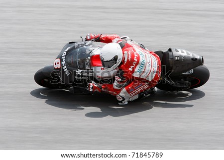 SEPANG, MALAYSIA - FEBRUARY 23: MotoGP rider Hector Barbera of Aspar Ducati team practices at the 2011 MotoGP winter tests at the Sepang International Circuit. February 23, 2011 in Malaysia.