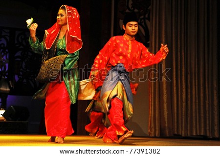 KUCHING, MALAYSIA - MAY 14: Ethnic Malays from Borneo island performs the zapin dance at the Sarawak Cultural Village, May14, 2010 in Kuching. The zapin dance is performed at weddings and joyous celebrations.