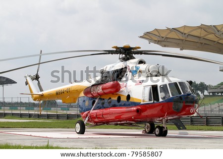 SEPANG - JUNE 17: A rescue helicopter from the Fire Department parks on standby in the Sepang International Circuit during the GT Asia Series race on June 17, 2011 in Sepang, Malaysia.