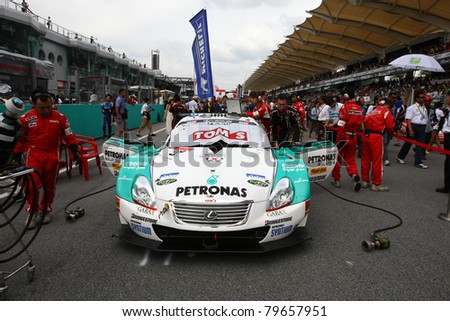SEPANG - JUNE 19: Lexus Team Petronas Tom\'s crew prepares the team\'s Lexus SC450 car for the race at the start of the Japan SUPER GT Round 3 on June 19, 2011 in Sepang International Circuit, Malaysia