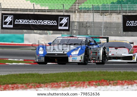 SEPANG, MALAYSIA - JUNE 18: The Nissan GTR car of Kondo Racing team puts in some practice laps in the Sepang International Circuit at the Japan SUPER GT Round 3 on June 18, 2011 in Sepang, Malaysia.